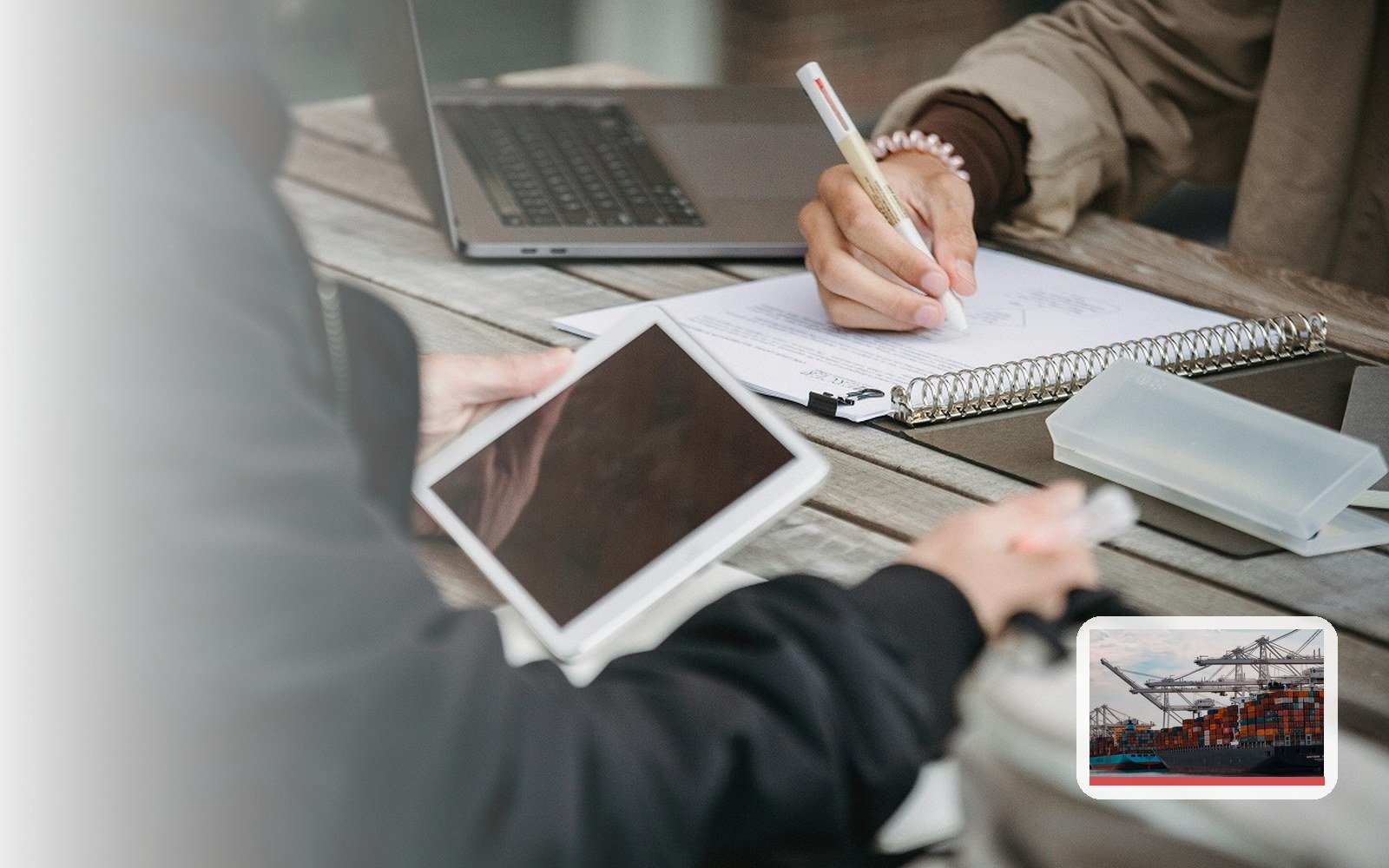 Business professionals planning with international trade support